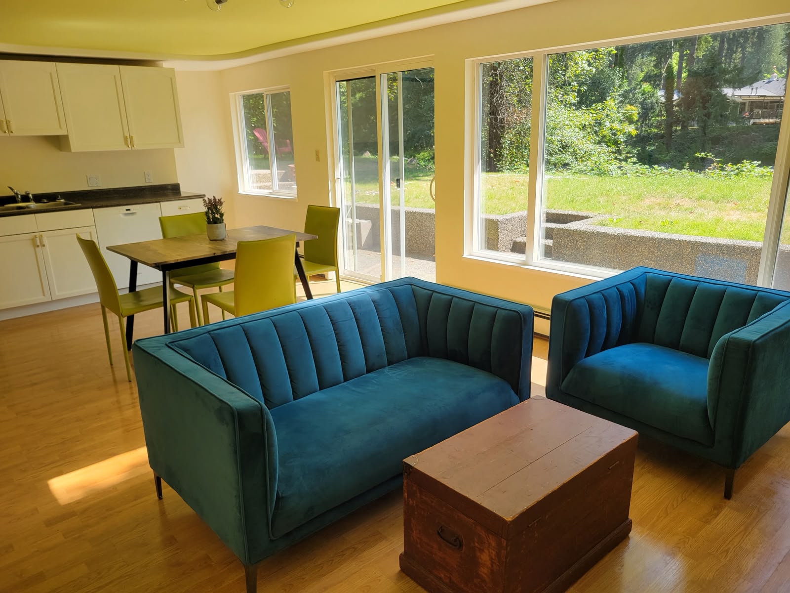 Living and dining area with sliding doors onto the lawn