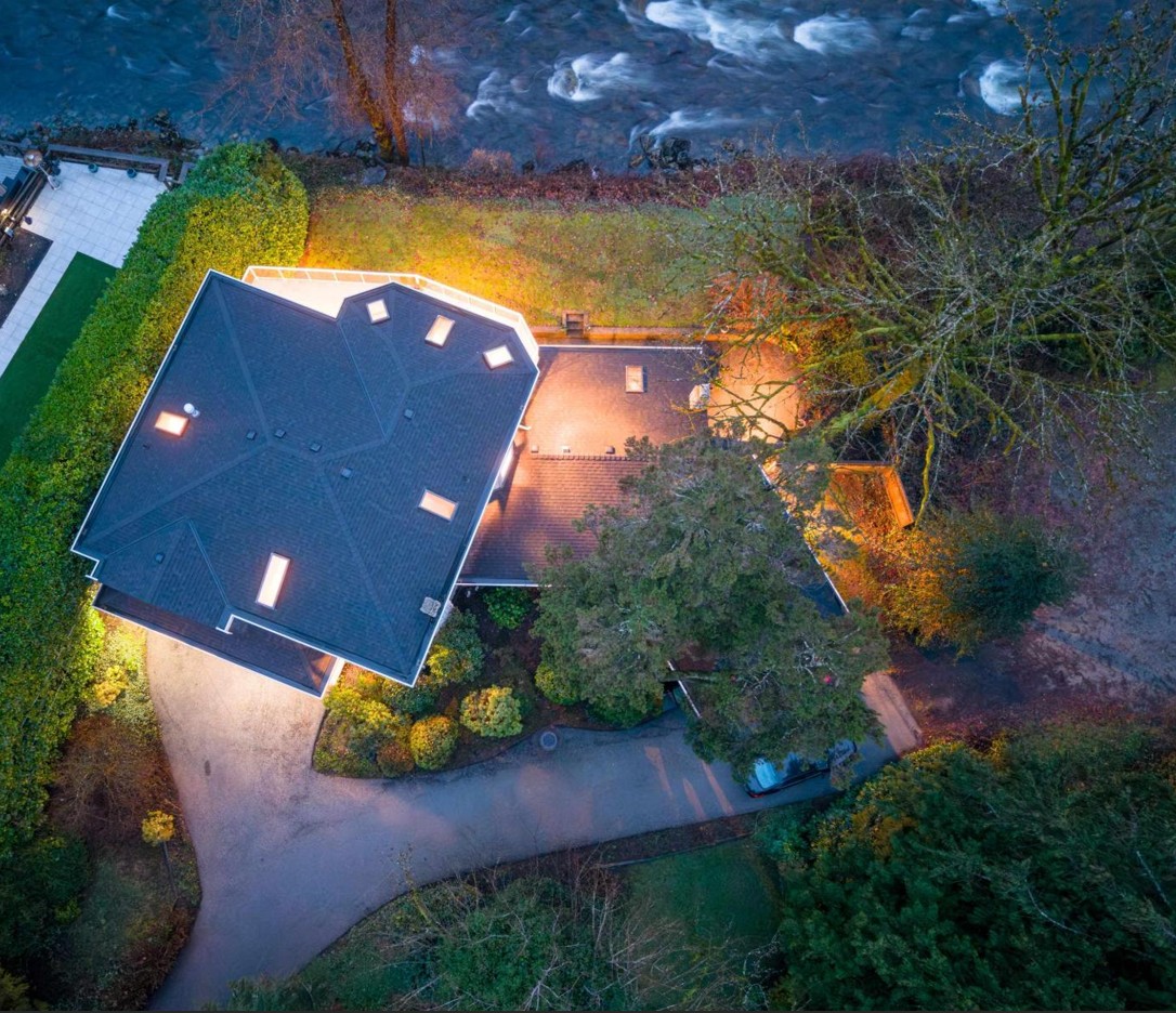 Overhead view of the house, patio, lawn and river