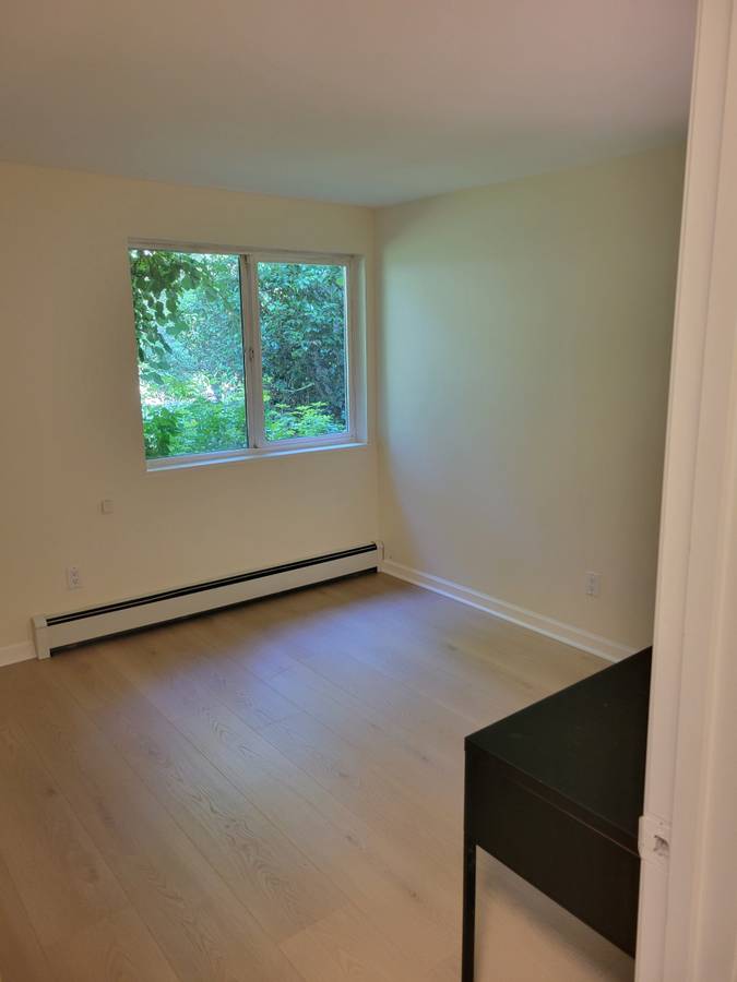 Second bedroom with desk and window onto the garden